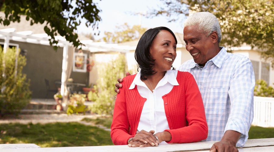 A-Black-older-couple-outside-their-home