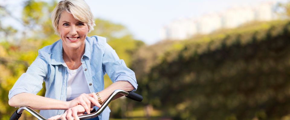 Canadian woman standing outdoors planning how to opt for living arrangements that offer companionship and financial stability.