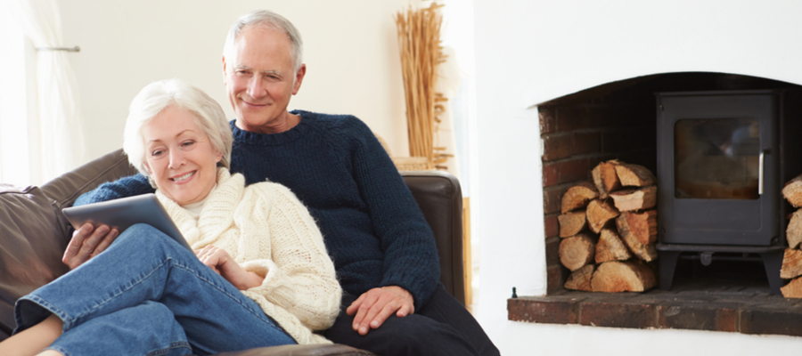 older-couple-sitting-cozily-on-the-sofa-spending-time