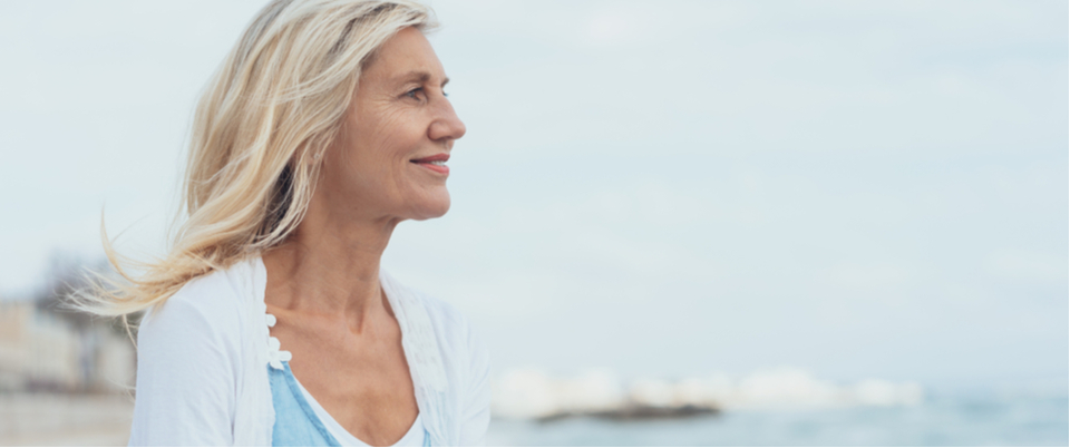 A woman looking at the view of water