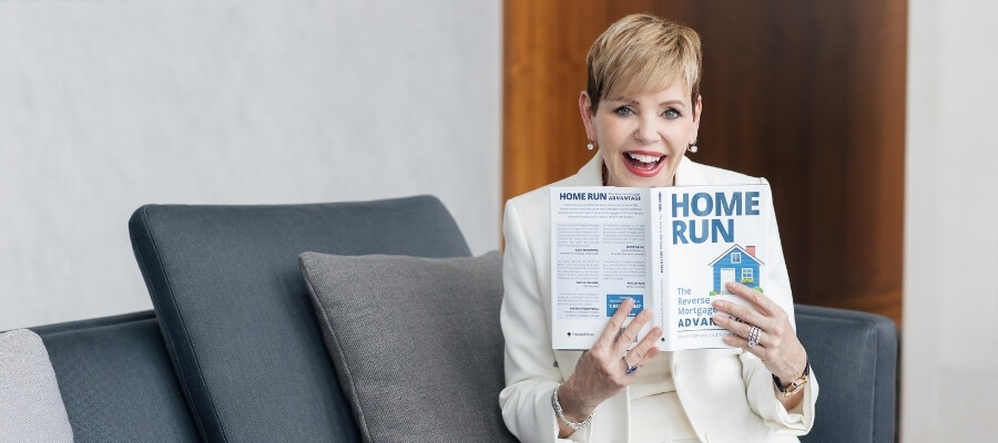 Pattie-lovett-reid-holding-home-run-book