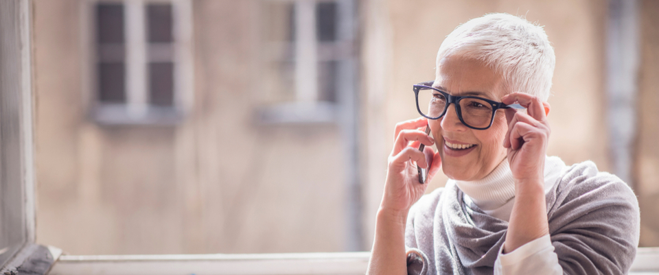 An older woman talking on her mobile phone