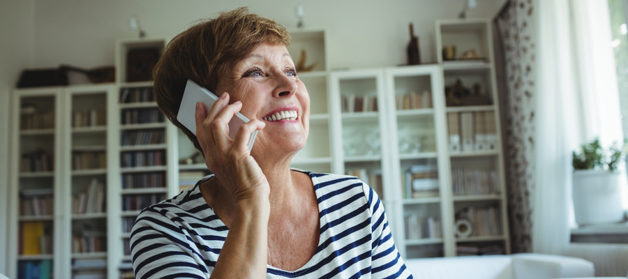 An older woman talking on her mobile phone