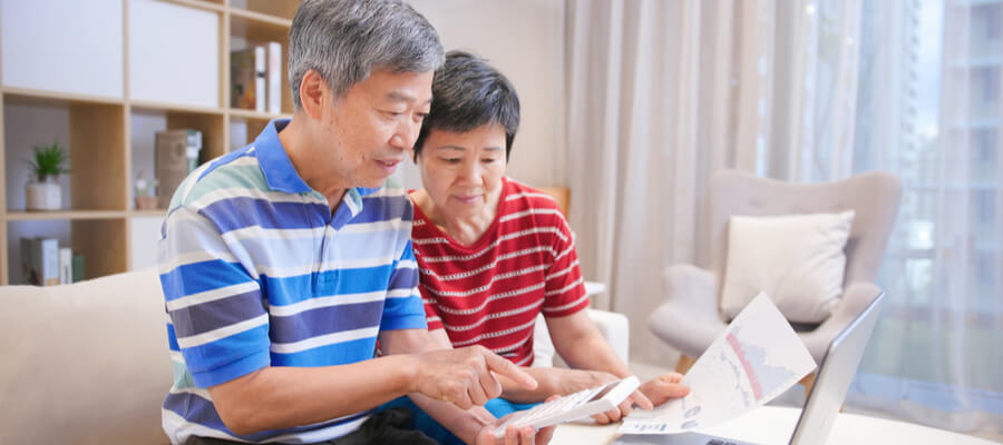 asian-elder-couple-calculate-home-equity-taxes