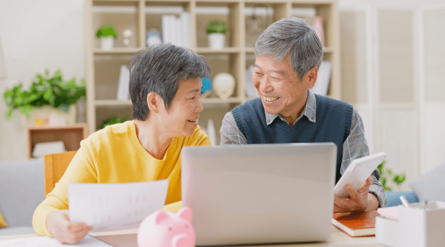 elderly-asian-couple-reviewing-their-retirement-income