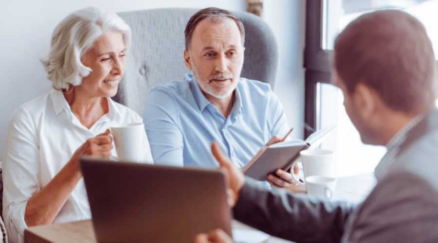 elderly-couple-discussing-their-rrsp-options-with-a-financial-advisor