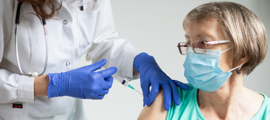 Elderly woman getting coronavirus vaccine