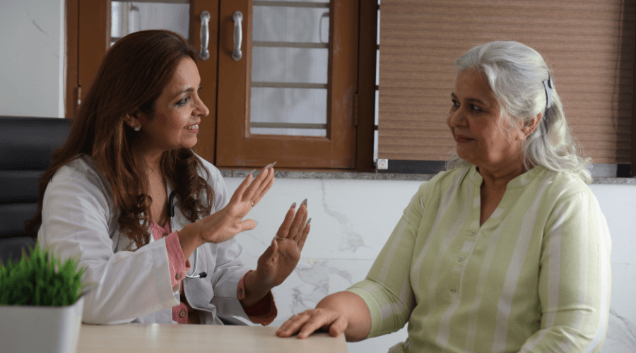 elderly-woman-seeking-help-from-a-healthcare-professional