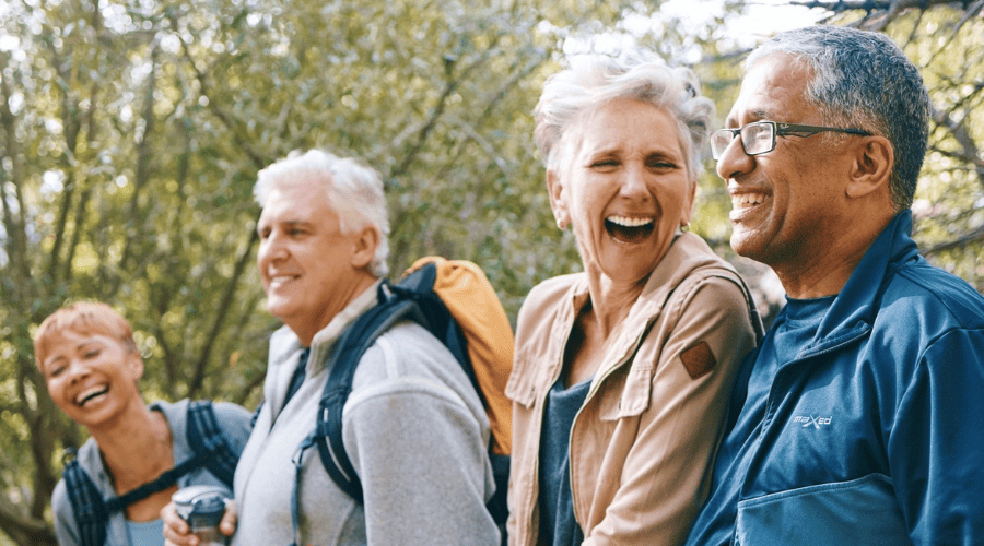 group-of-older-people-laughing-outside-together