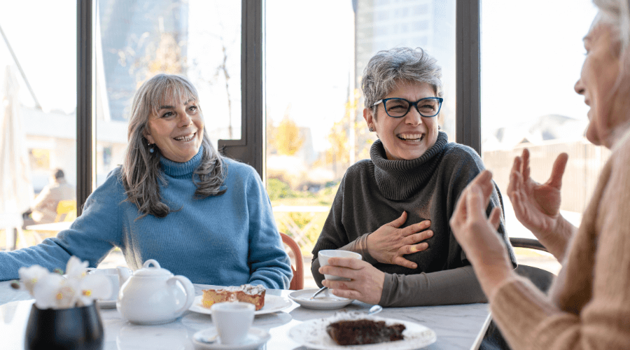 group-of-women-55+-have-breakfast-and-laugh-resized