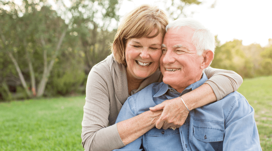 happy-elderly-couple-hugging-each-other