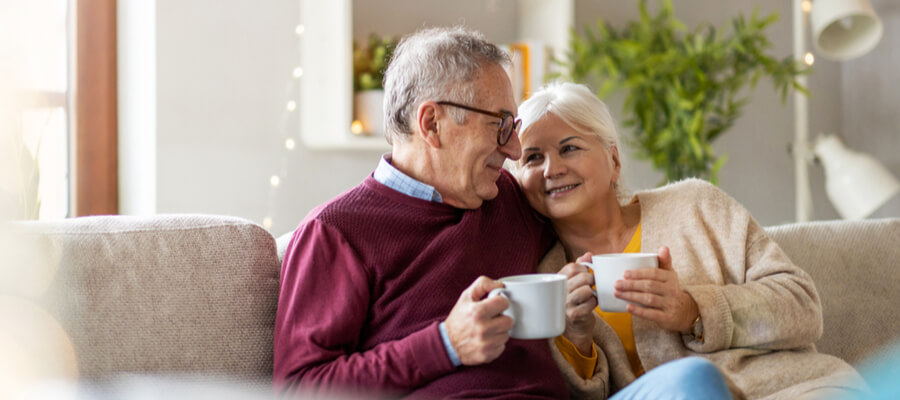 happy-elderly-couple-relaxing-at-home-and-planning-their-future