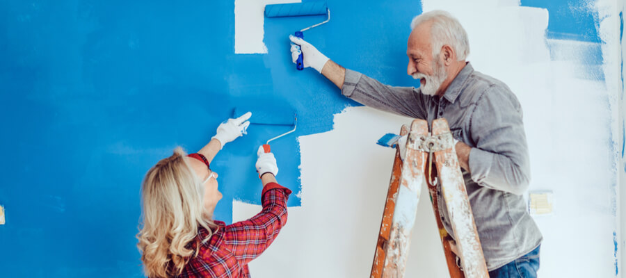 Happy senior couple renovating their home