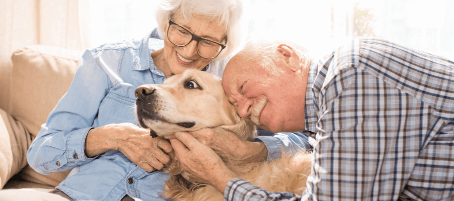 man-and-woman-with-their-pet-dog-cuddling