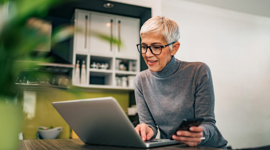 modern-mature-woman-using-laptop-for-online-dating