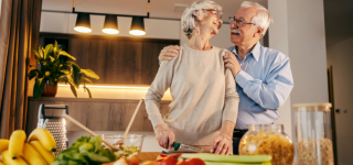 older-couple-cooking-happily-in-their-condominium