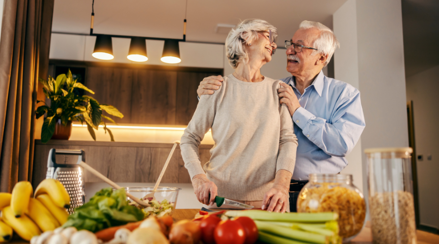 older-couple-cooking-happily-in-their-condominium