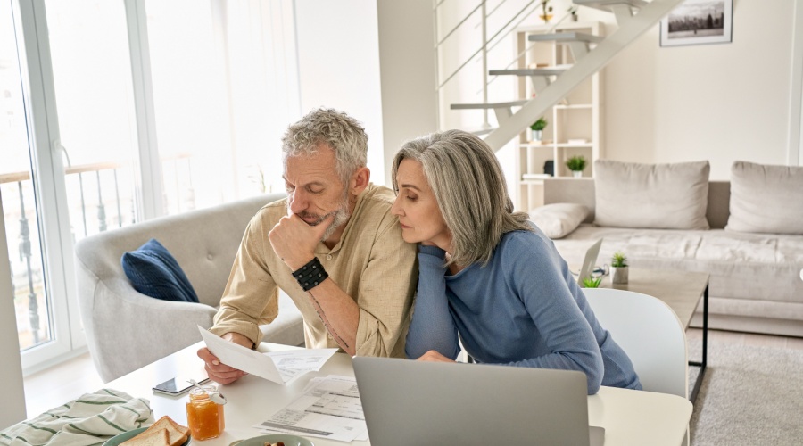 Older couple looking at the cost of downsizing