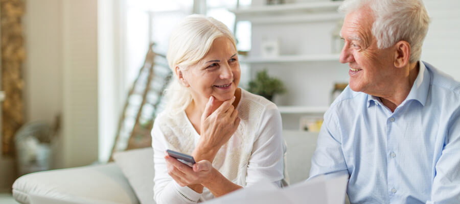 older-couple-reviewing-financial-papers-together