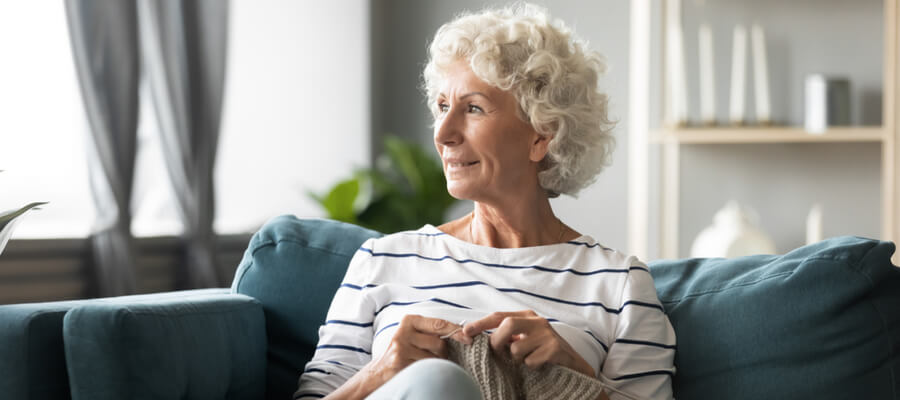 pensive-mature-woman-sitting-looking-out-the-window