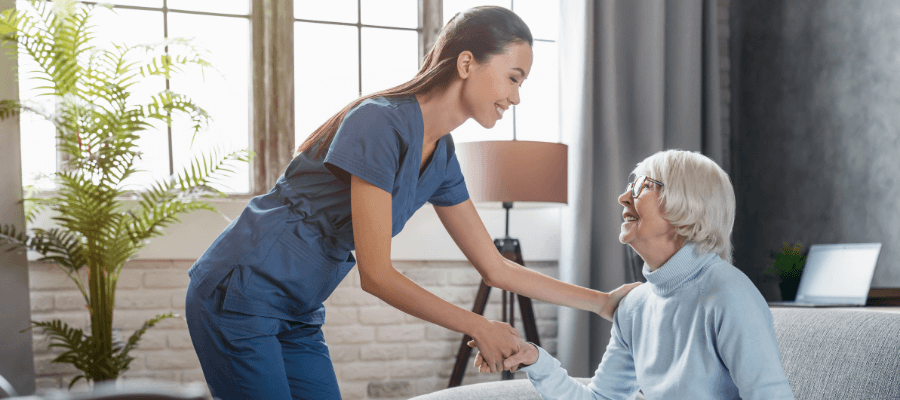personal-support-worker-helping-elderly-woman