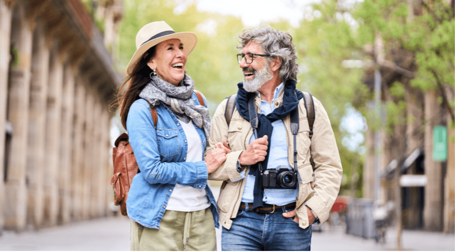 retired-couple-enjoying-travelling-and-smiling