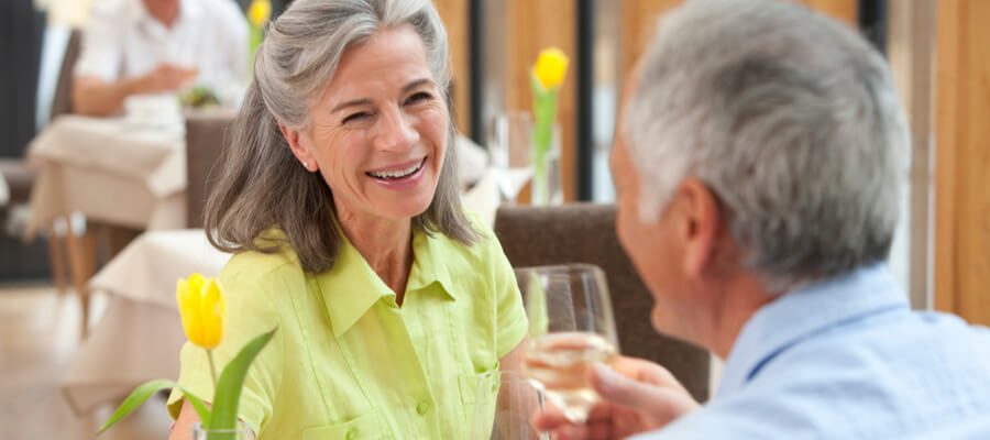 retired-couple-enjoying-over-dinner-date-in-a-restaurant