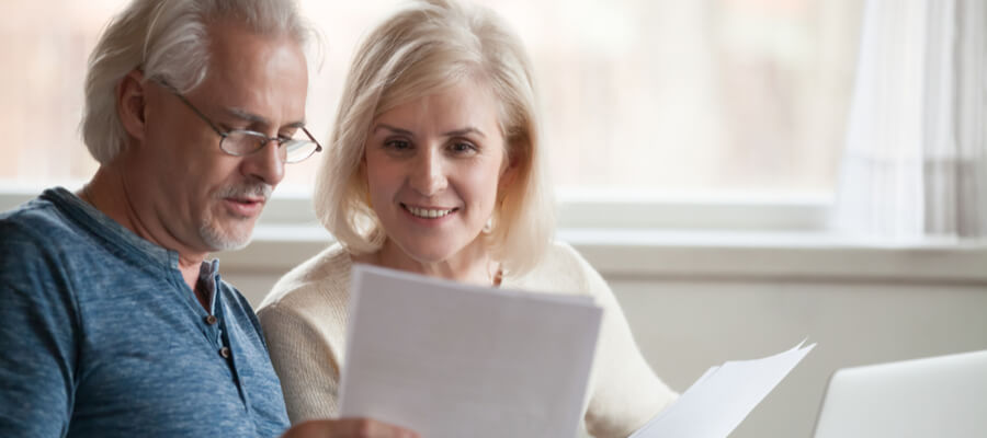 senior-couple-looking-at-financial-documents