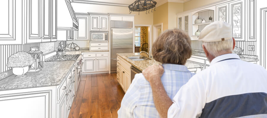 Senior couple looking over custom kitchen home renovations