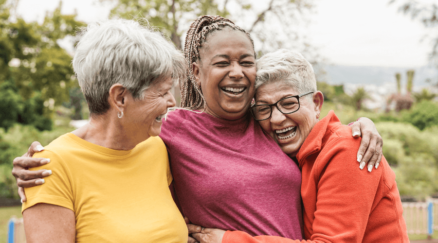 three-elderly-women-laughing-enjoying-their-company